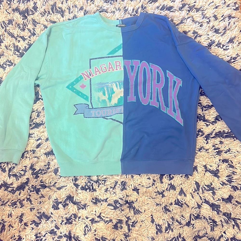 split crewneck, tags off but brand new